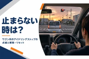信号待ちをする軽自動車の運転席から見たメーターと赤信号